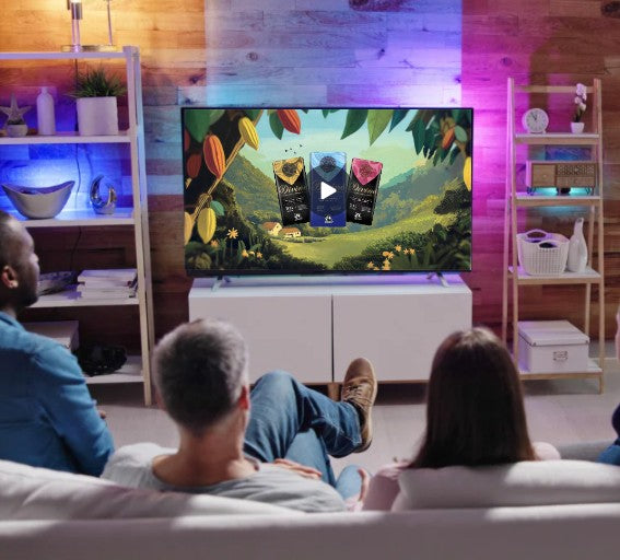 People sat on a sofa watching a TV advert